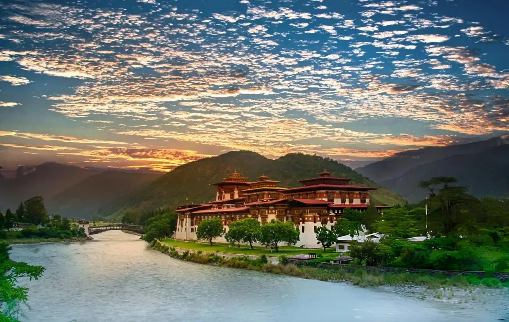 A dzong on the river at dusk